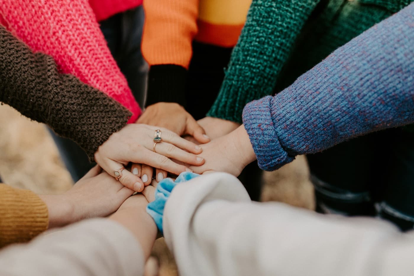 Team stacking hands together